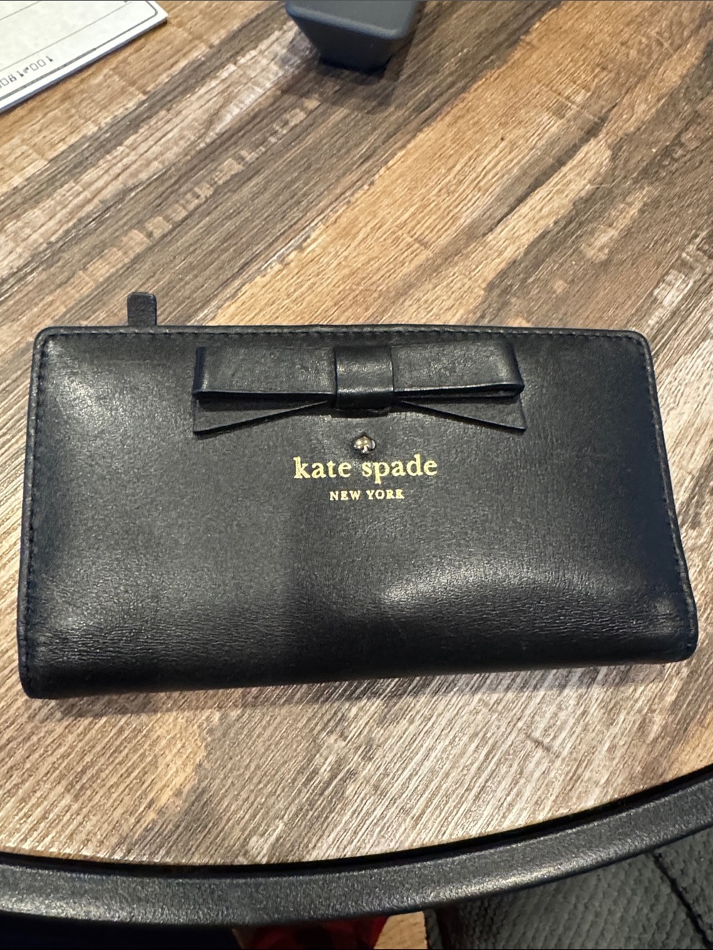 kate spade black bow zip-around wallet